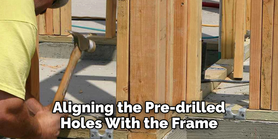 Aligning the Pre-drilled Holes With the Frame