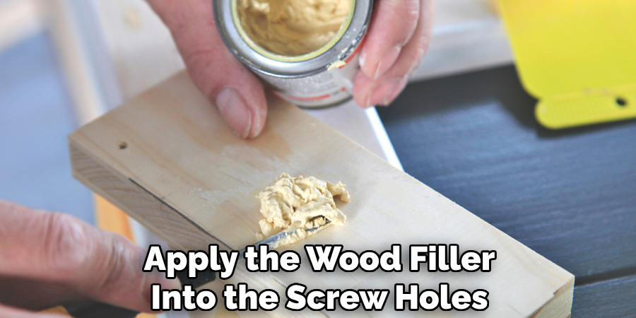 Apply the Wood Filler Into the Screw Holes