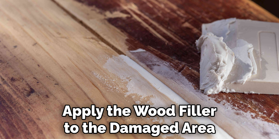 Apply the Wood Filler to the Damaged Area