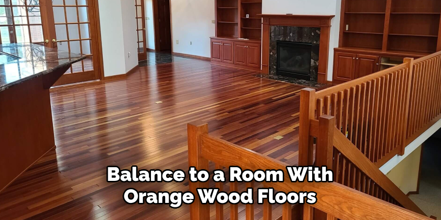 Balance to a Room With Orange Wood Floors