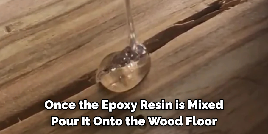 Once the Epoxy Resin is Mixed Pour It Onto the Wood Floor