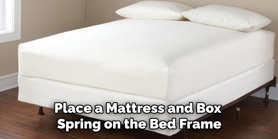 Place a Mattress and Box Spring on the Bed Frame