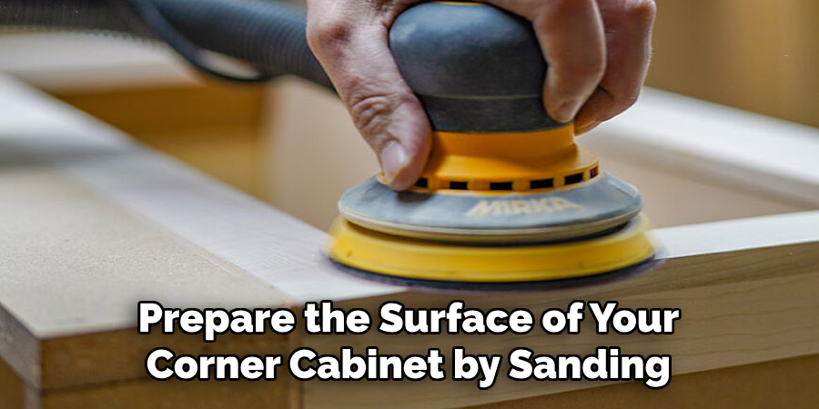 Prepare the Surface of Your Corner Cabinet by Sanding