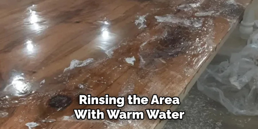 Rinsing the Area With Warm Water