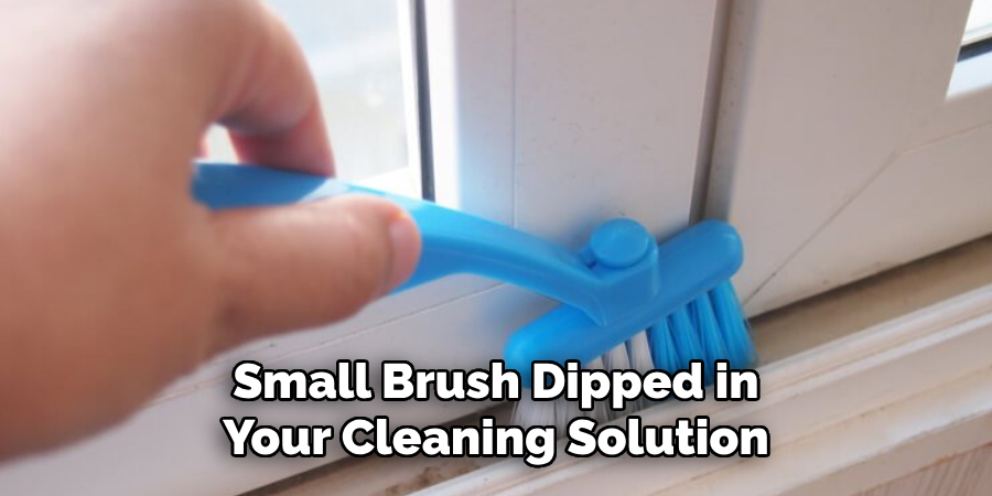 Small Brush Dipped in Your Cleaning Solution