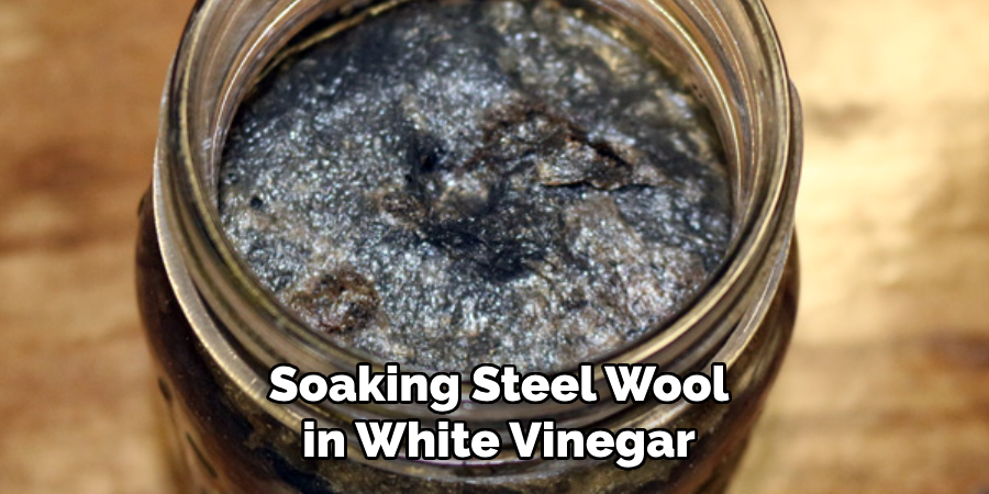 Soaking Steel Wool in White Vinegar