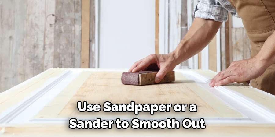 Use Sandpaper or a Sander to Smooth Out