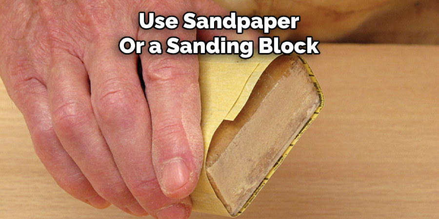 Use Sandpaper or a Sanding Block