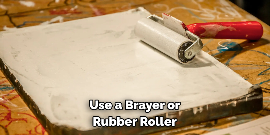 Use a Brayer or Rubber Roller