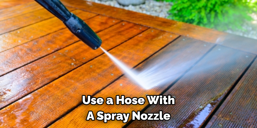 Use a Hose With A Spray Nozzle