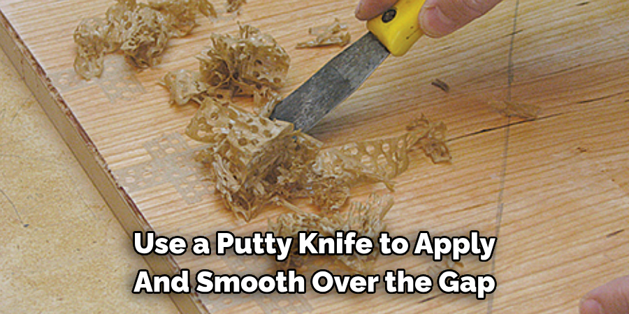 Use a Putty Knife to Apply And Smooth Over the Gap