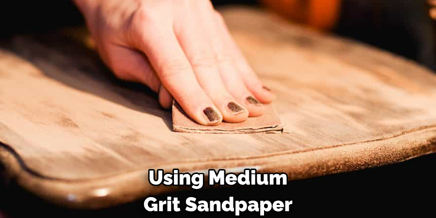 Using Medium Grit Sandpaper