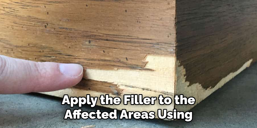 Apply the Filler to the Affected Areas Using