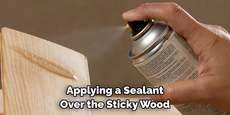 Applying a Sealant Over the Sticky Wood 