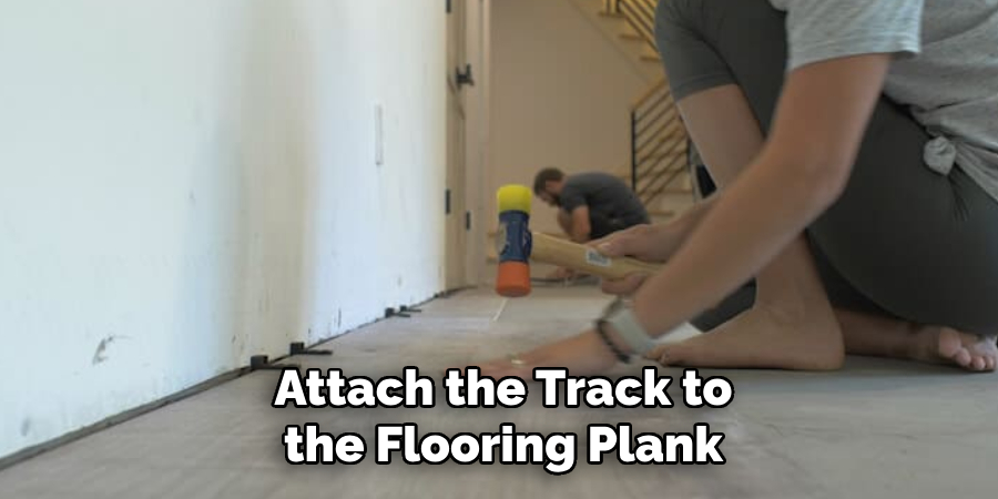 Attach the Track to the Flooring Plank