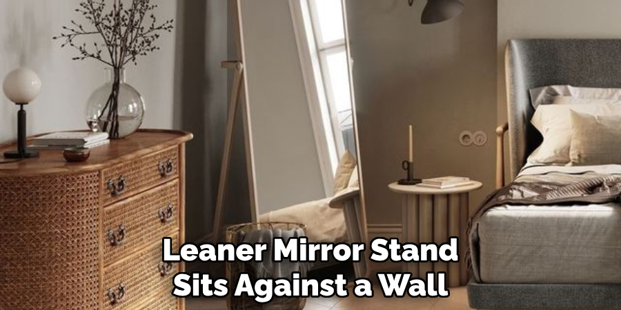 Leaner Mirror Stand Sits Against a Wall