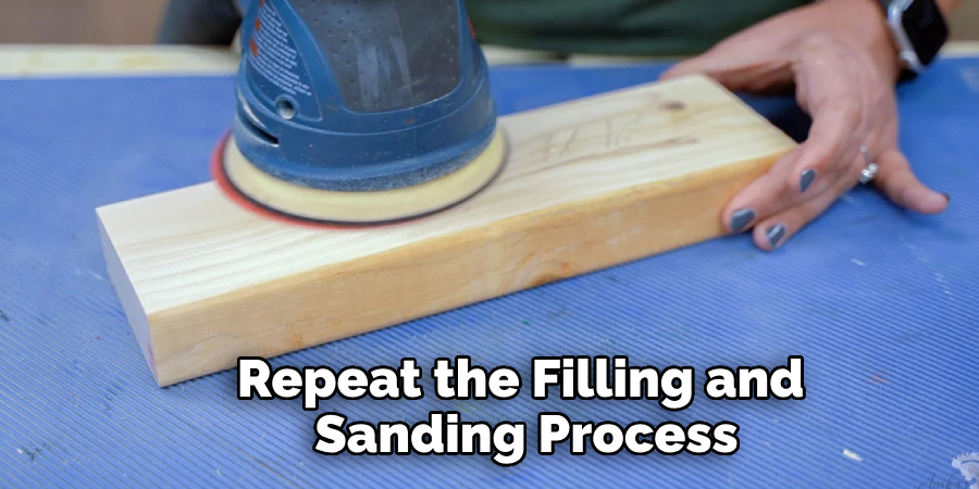 Repeat the Filling and Sanding Process