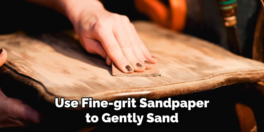 Use Fine-grit Sandpaper to Gently Sand