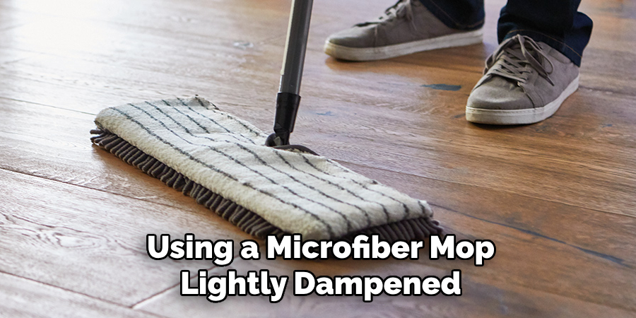 Using a Microfiber Mop Lightly Dampened