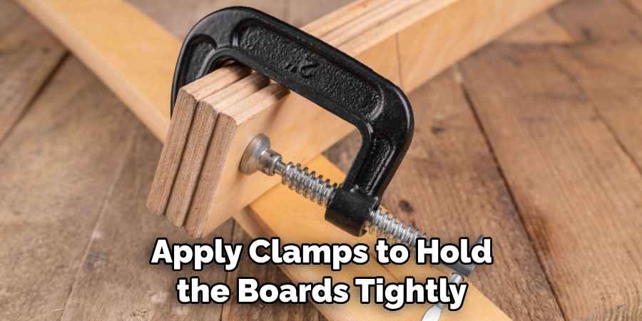 Apply Clamps to Hold the Boards Tightly