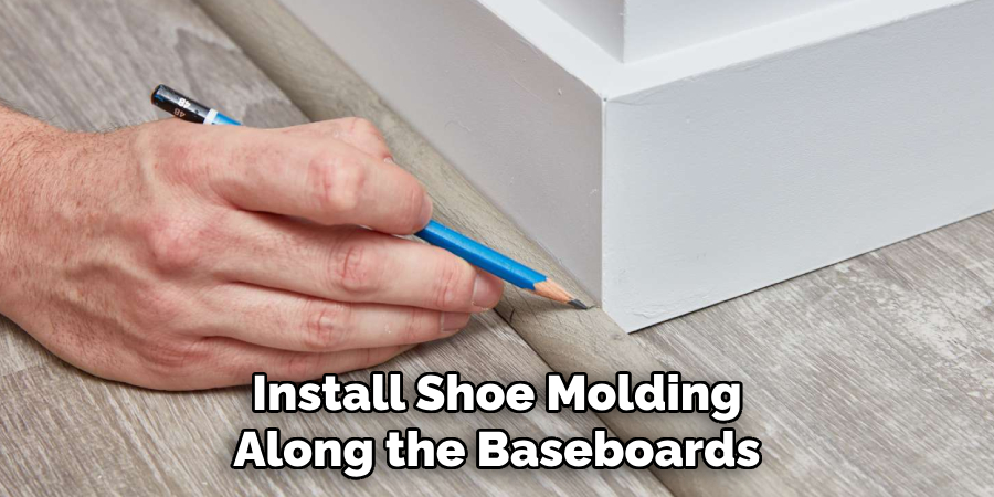 Install Shoe Molding Along the Baseboards