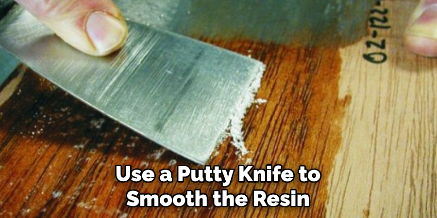 Use a Putty Knife to Smooth the Resin