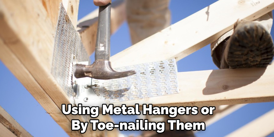 Using Metal Hangers or By Toe-nailing Them