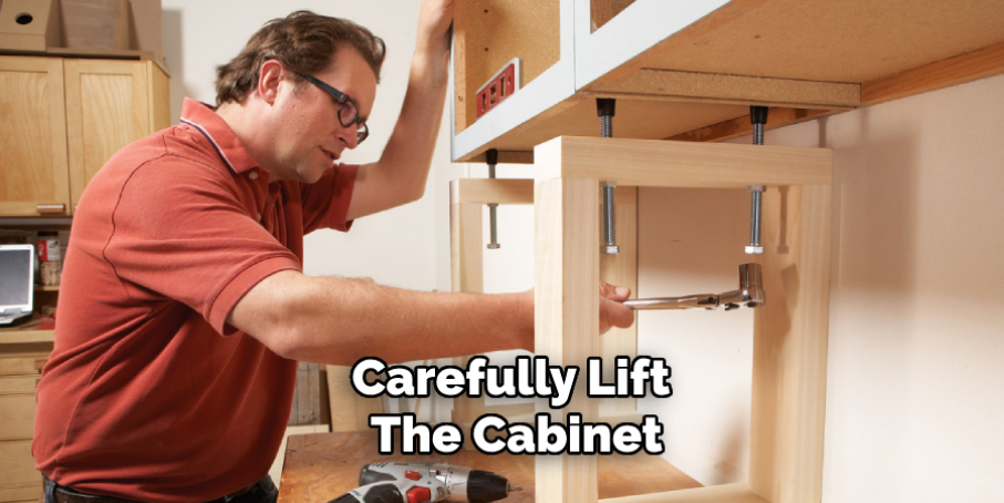 Carefully Lift the Cabinet