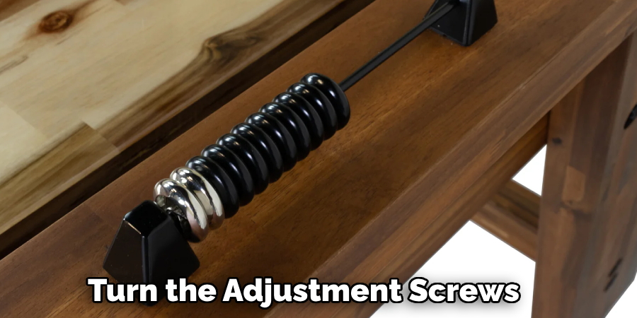 Turn the Adjustment Screws