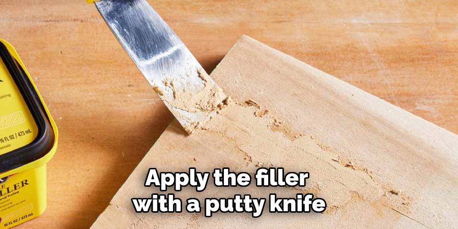 Apply the filler 
with a putty knife