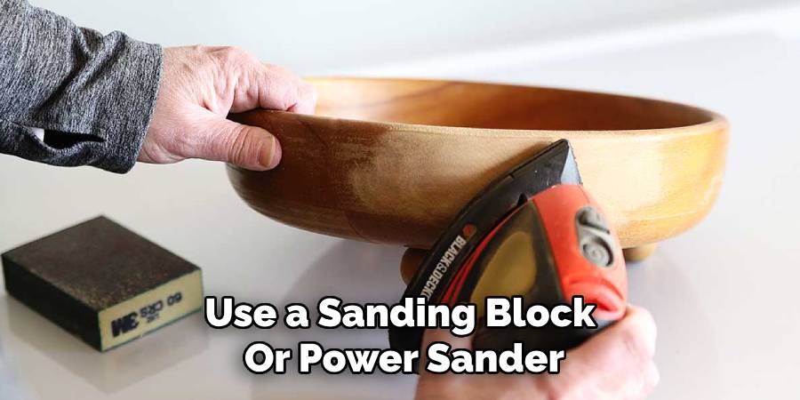 Use a Sanding Block 
Or Power Sander