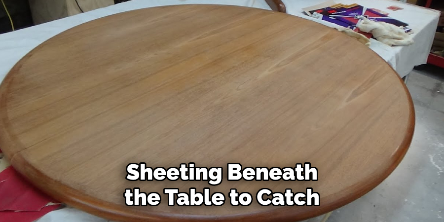 Sheeting Beneath the Table to Catch