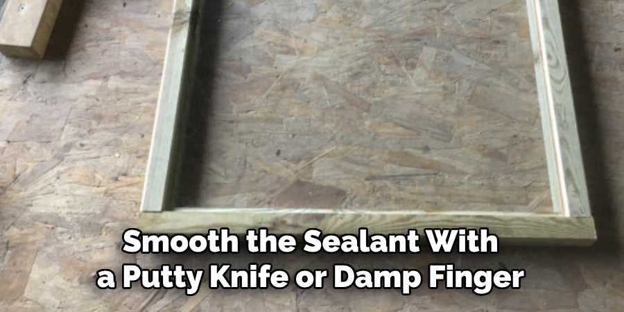 Smooth the Sealant With a Putty Knife or Damp Finger