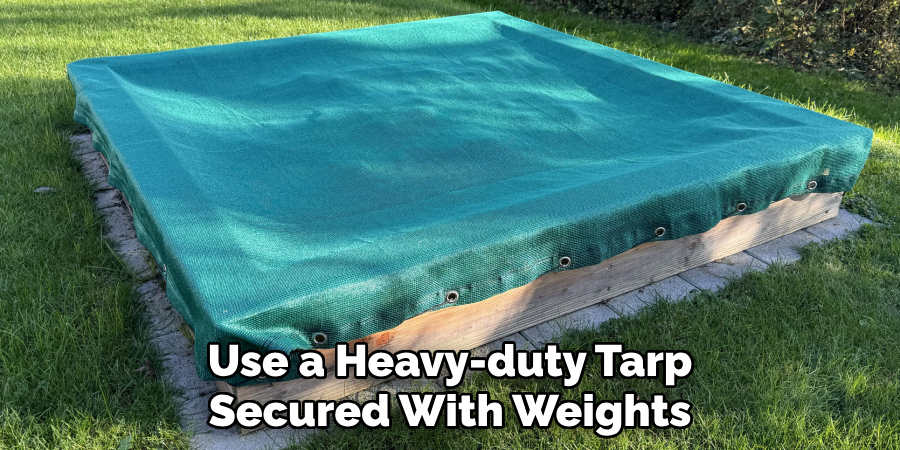 Use a Heavy-duty Tarp
Secured With Weights