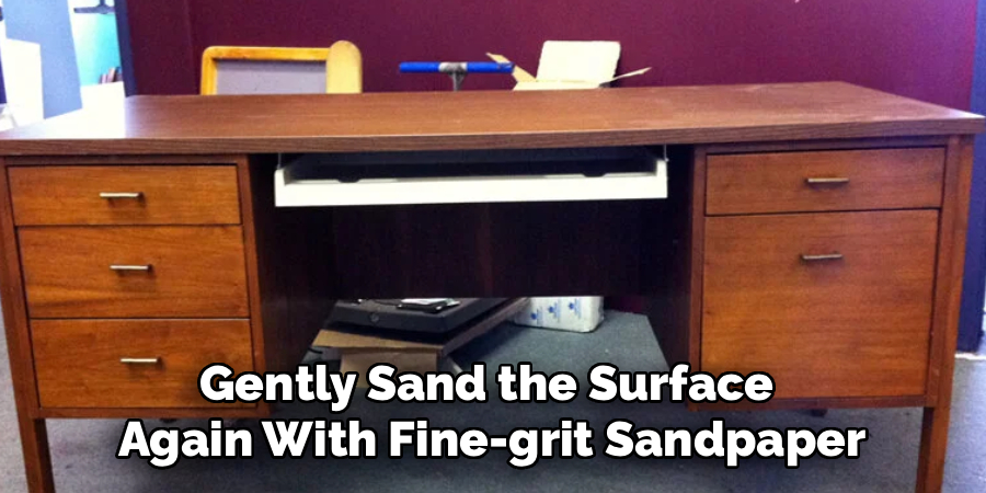 Gently Sand the Surface 
Again With Fine-grit Sandpaper