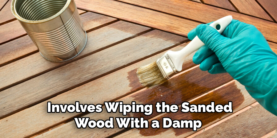  Involves Wiping the Sanded 
Wood With a Damp 