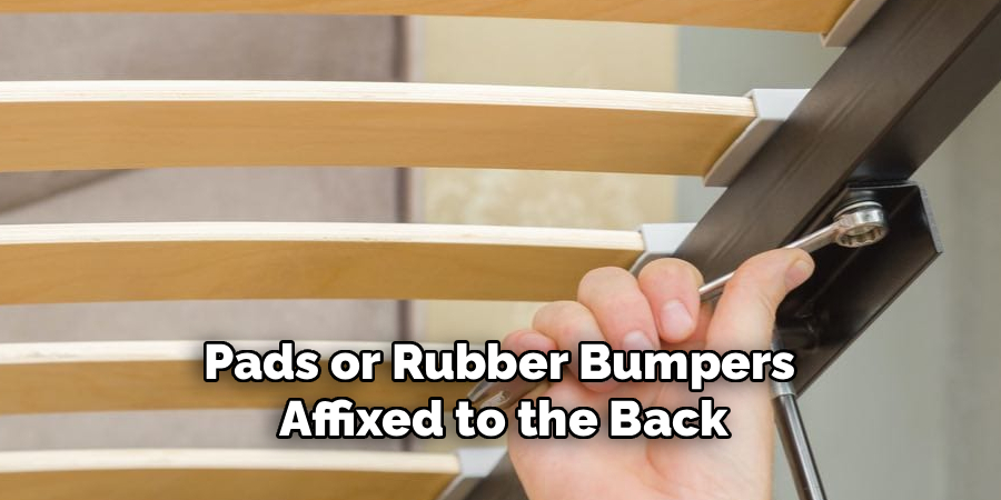 Pads or Rubber Bumpers
 Affixed to the Back