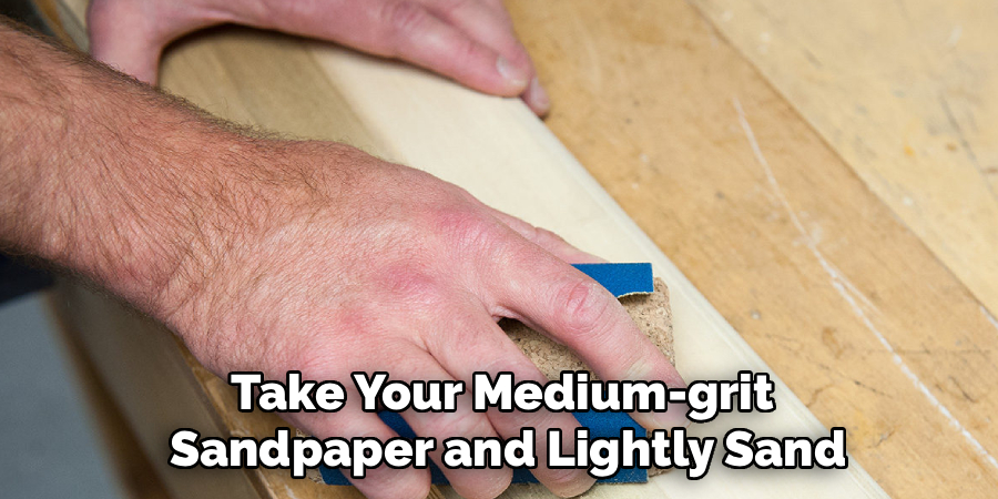 Take Your Medium-grit
 Sandpaper and Lightly Sand